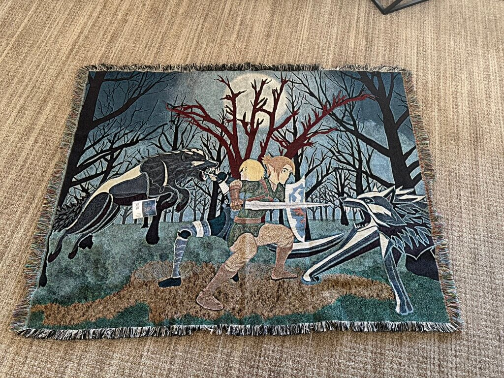 Warriors fighting wolves woven into a blanket
